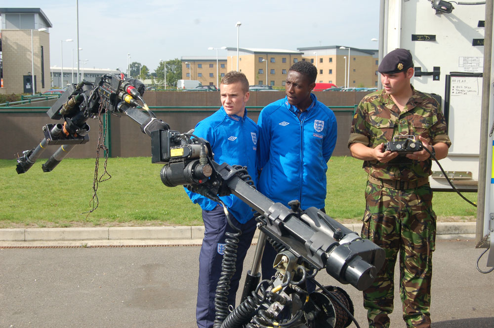 Tom Cleverley and Danny Welbeck inspect some high-tech machinery.